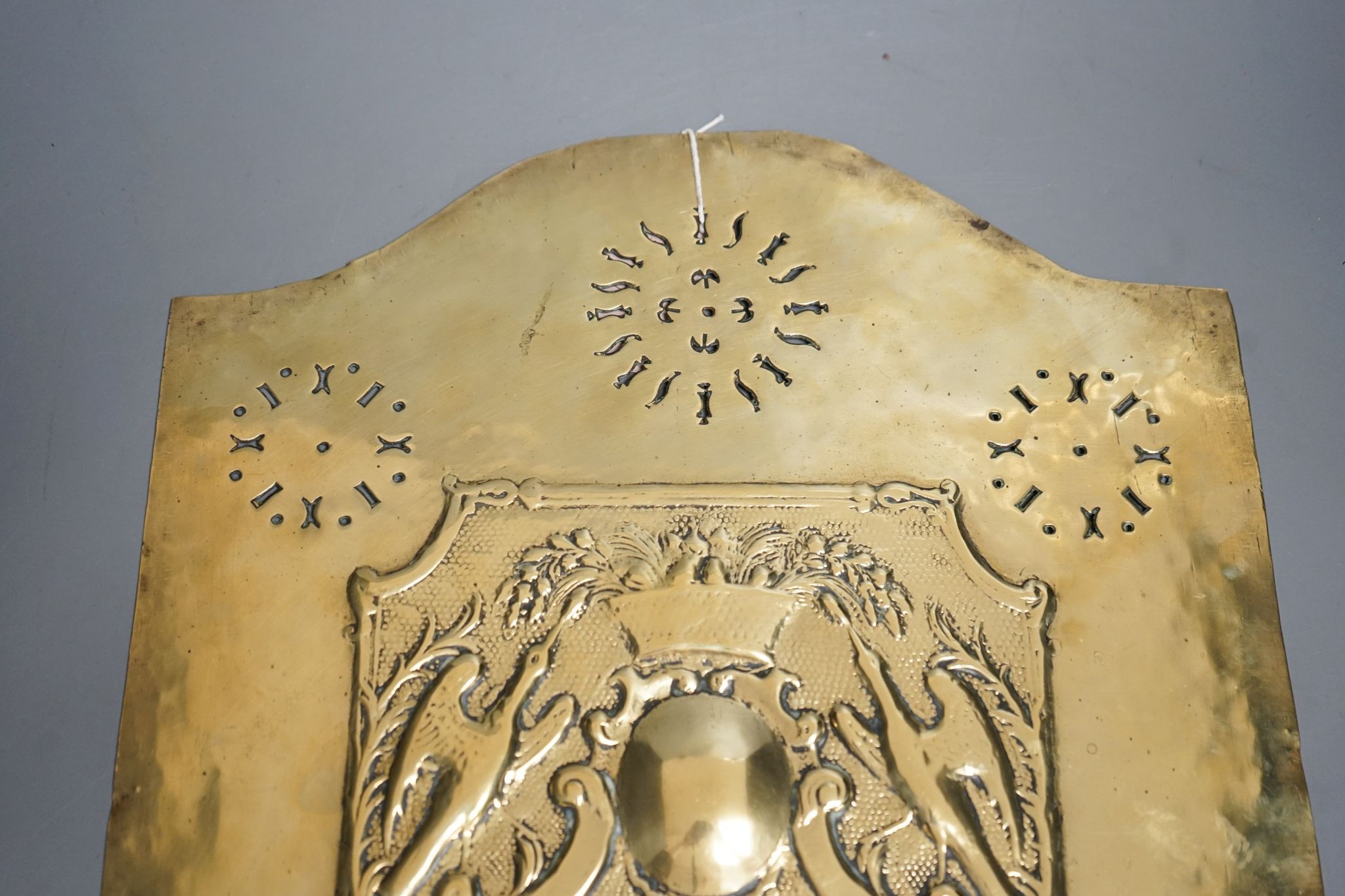 A Georgian pierced and embossed brass plate/panel, 37x32cm